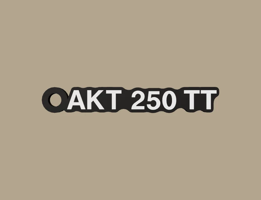 Llavero AKT AKT 250 TT, base negra y texto blanco, vista frontal del modelo 3D
