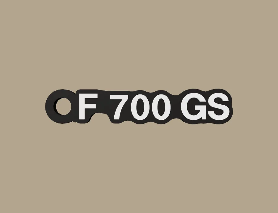 Llavero BMW Motorrad F 700 GS, base negra y texto blanco, vista frontal del modelo 3D