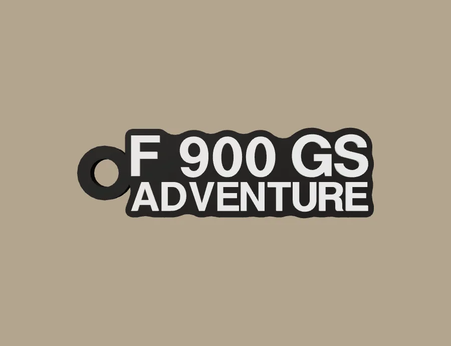 Llavero BMW Motorrad F 900 GS ADVENTURE, base negra y texto blanco, vista frontal del modelo 3D