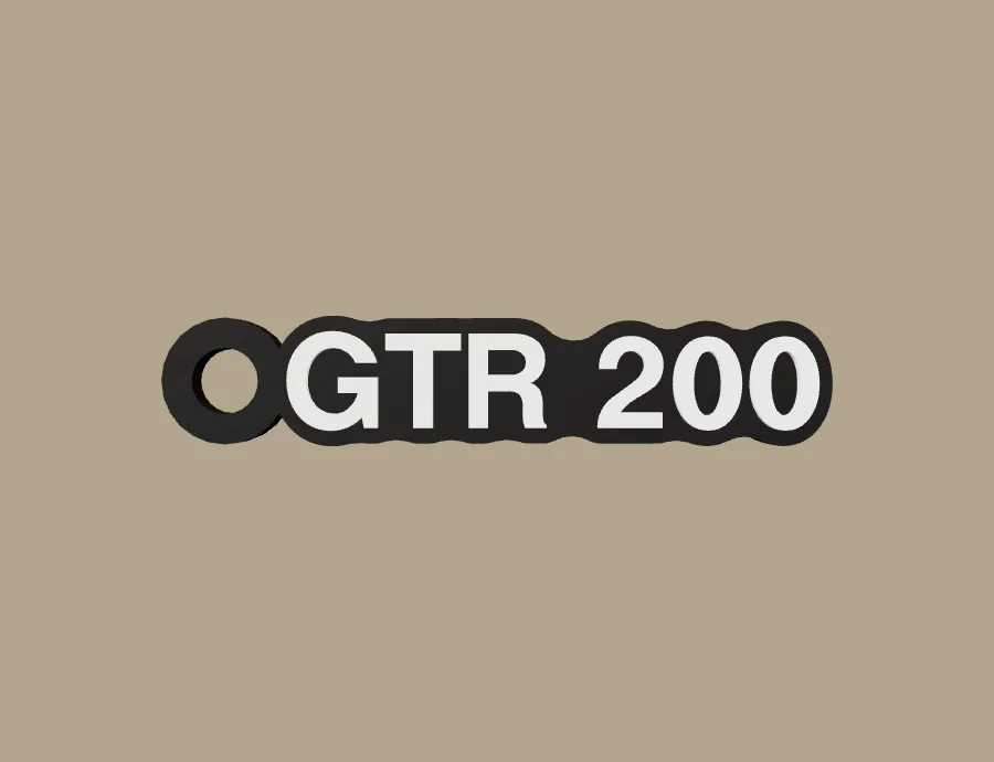 Llavero UM GTR 200, base negra y texto blanco, vista frontal del modelo 3D