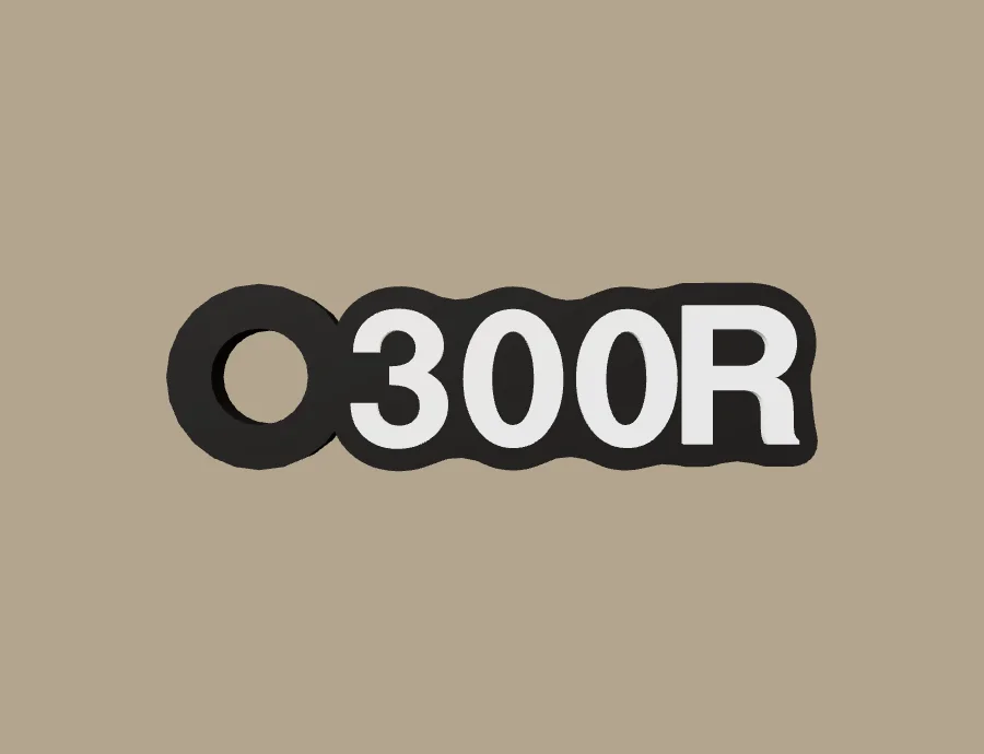 Llavero VOGE 300R, base negra y texto blanco, vista frontal del modelo 3D